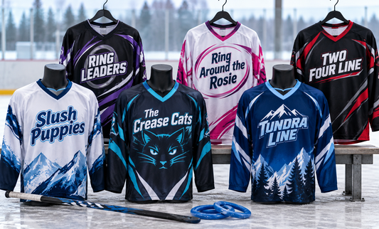 Six custom sublimated ringette jerseys displayed at a rink with rings and sticks