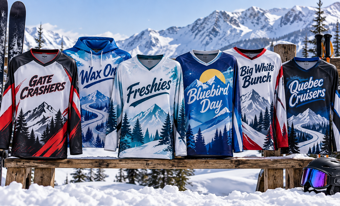 Six custom sublimated ski team jerseys on a rail with a mountain backdrop