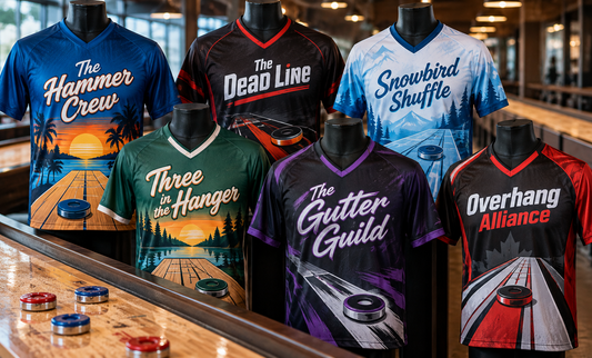 Six jerseys on mannequins beside shuffleboard tables, printed with team names
